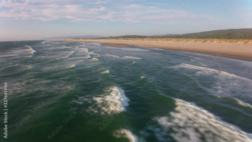 Oregon Coast circa-2019. Aerial view of waves and beach. Shot from helicopter with cineflex gimal and RED 8K camera. Oregon Coast circa-2019. Aerial view of waves and beach. Shot from helicopter with cineflex gimal and RED 8K camera.