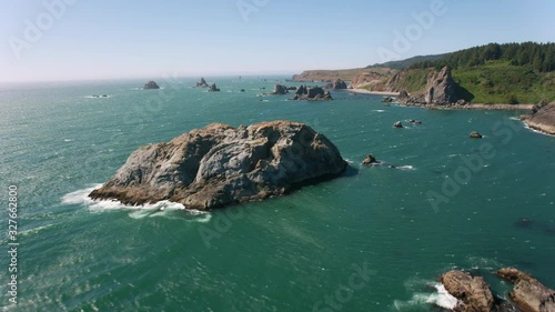 Oregon Coast circa-2019.  Aerial view of rocky coastline.  Shot from helicopter with cineflex gimal and RED 8K camera. photo