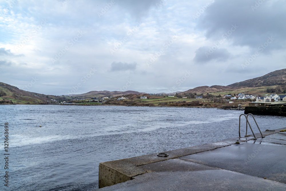 The pier in Portnacross looking to Glenlee Carrigan Head seen from Portnacross in County Donegal - Ireland. The pier in Portnacross looking to Glenlee Carrigan Head seen from Portnacross in County Donegal - Ireland.