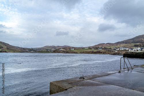 The pier in Portnacross looking to Glenlee Carrigan Head seen from Portnacross in County Donegal - Ireland. photo