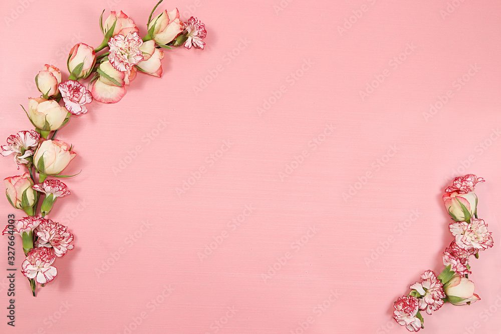 Arrangement of flowers on a pink isolated background, place for text, flat lay. Creative modern bouquet, minimal holiday and spring concept. Greeting card for Women's Day  ,happy birthday, wedding,