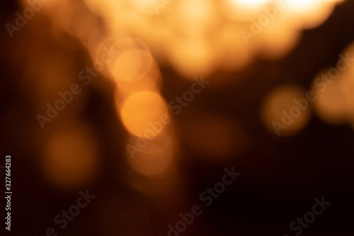abstract glowing bokeh lights on dark background