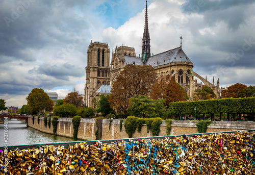 Cathédrale Notre-Dame de Paris, France with the love lock bridge and river
