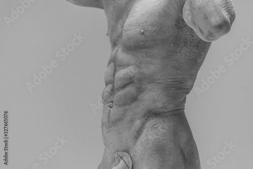 Antique sculpture of a man on a white background photo