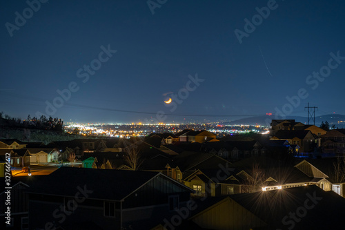 Photography Late night view over Spokane and the Spokane Valley with a full moon in Spokane, Washington, USA