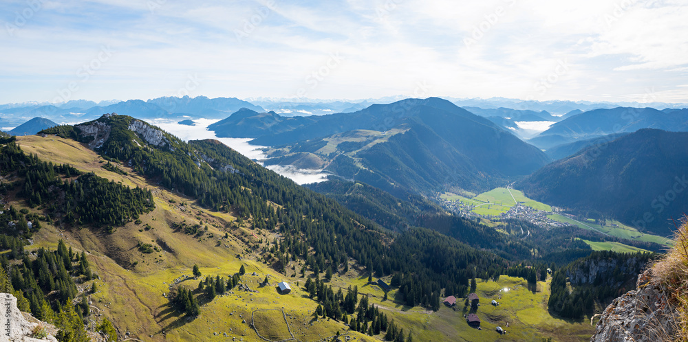 Fototapeta premium panorama view from Wendelstein mountain, green pasture in the bavarian alps and valley