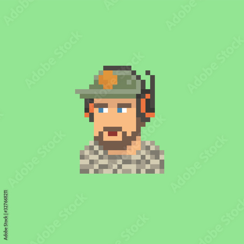 Pixel art vector illustration of a young man with a beard wearing a baseball cap and a black headset, game streamer on green screen background