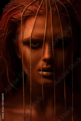 Portrait of a girl with a chain and creative make-up