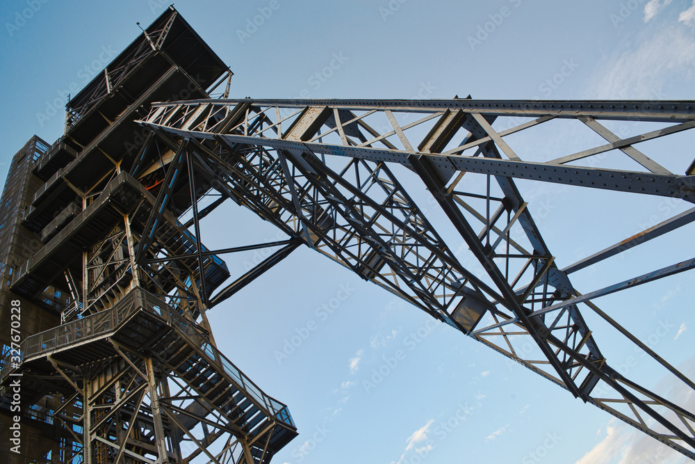 Mining shaft in upper Silesia. Coal mining site, elevator for miners. Industrial and urban concept. Industrial areas, historic mining shaft as an exhibit to visit. Mines.