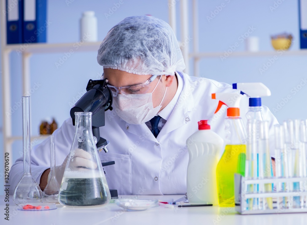 Man in the lab testing new cleaning solution detergent Man in the lab testing new cleaning solution detergent
