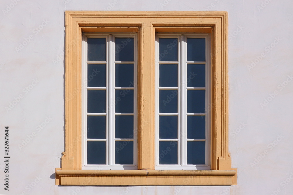 Renaissance double window frame at the Amtshaus building facade in the old town of Trier Pfalzel in Germany Renaissance double window frame at the Amtshaus building facade in the old town of Trier Pfalzel in Germany
