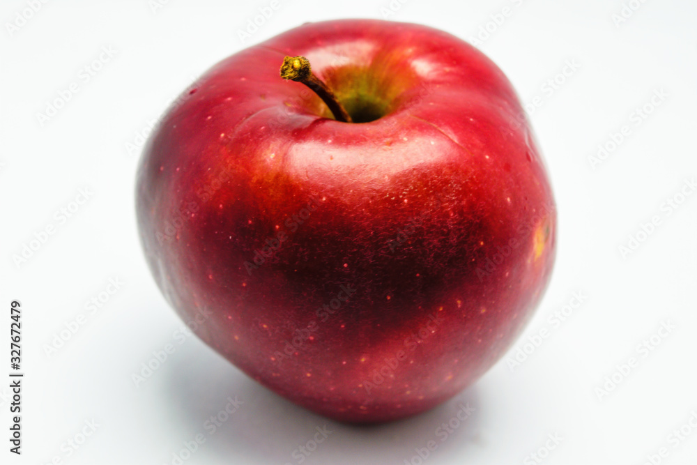 Ripe red red apple close-up isolate on a white background. Ripe red red apple close-up isolate on a white background.