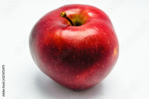 Ripe red red apple close-up isolate on a white background.