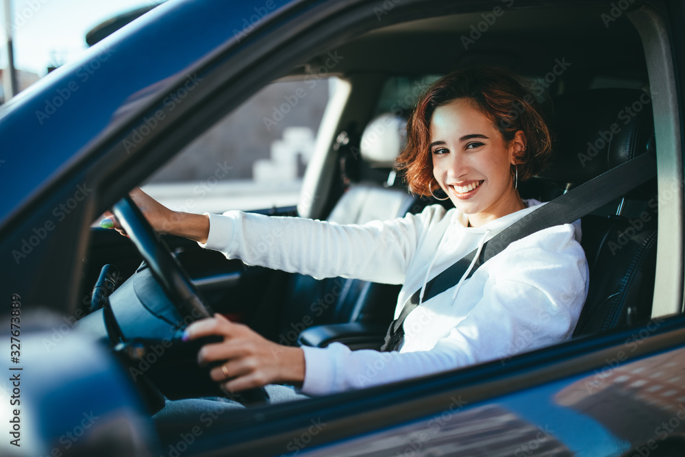 young girl driving a car