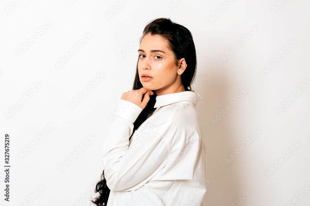 portrait of a beautiful young woman with long black hair on white background portrait of a beautiful young woman with long black hair on white background