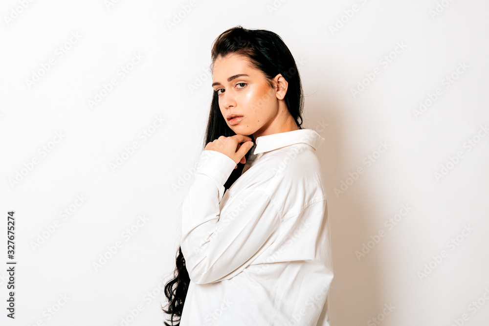 portrait of a beautiful young woman with long black hair on white background portrait of a beautiful young woman with long black hair on white background
