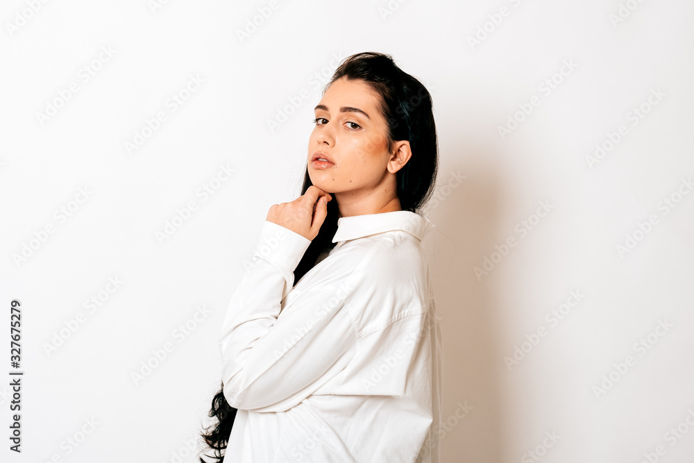 portrait of a sensual young woman with long black hair on white background portrait of a sensual young woman with long black hair on white background
