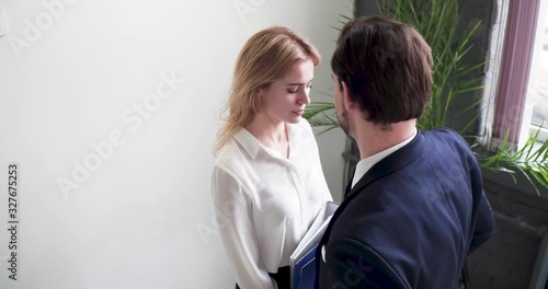Flirtation or sexual harassment recognize and report. Identifying harassment, Sexual harassment at work. Man and woman colleagues flirt in office, Recognize pursuer