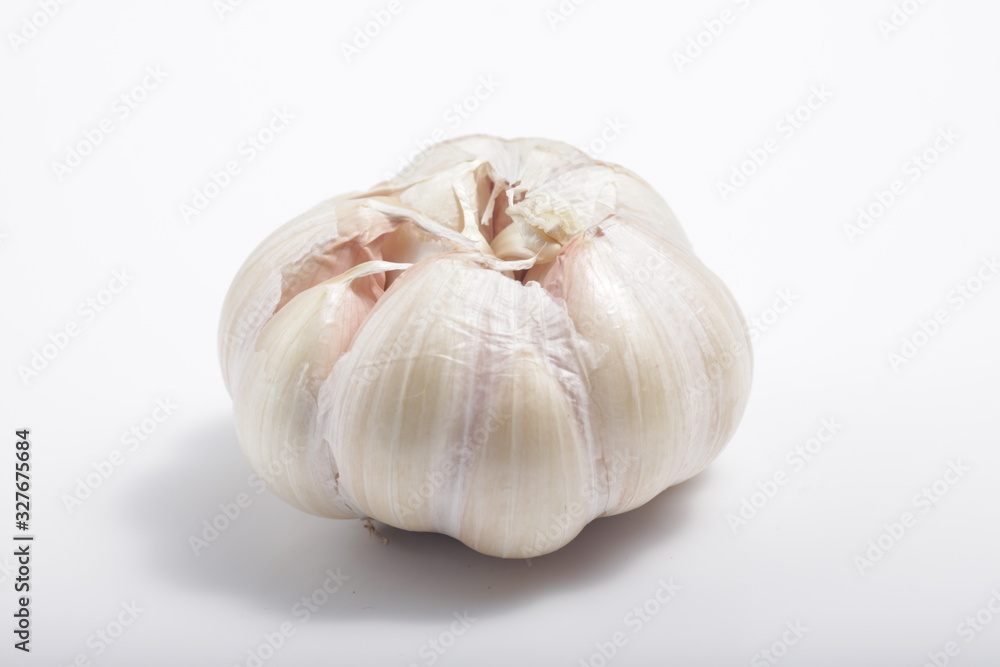 Close - up shot of garlic on a white isolated background Close - up shot of garlic on a white isolated background