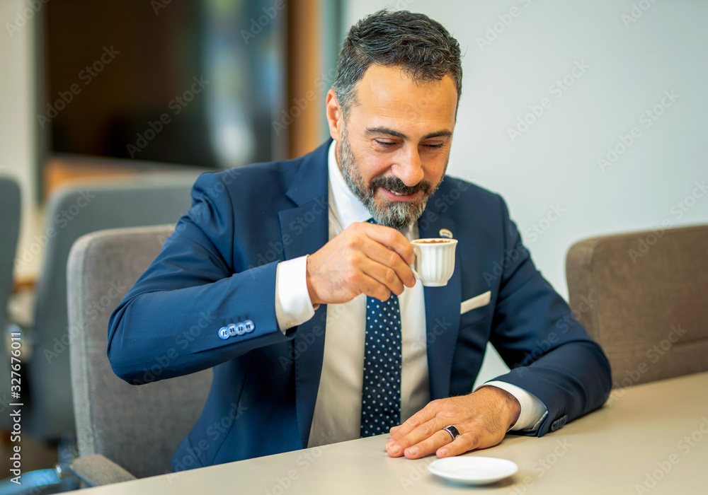 Workplace employee who drinks Turkish coffee between work, coffee break