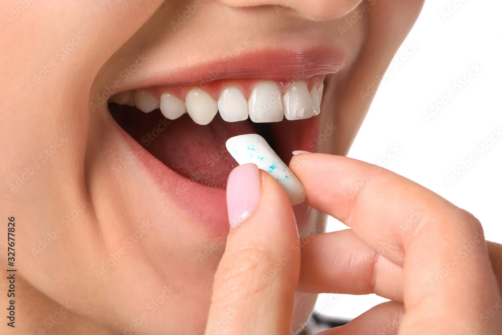 Fototapeta premium Young woman with chewing gum, closeup