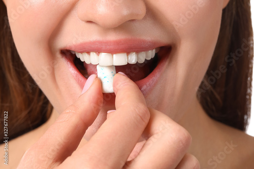 Young woman with chewing gum, closeup