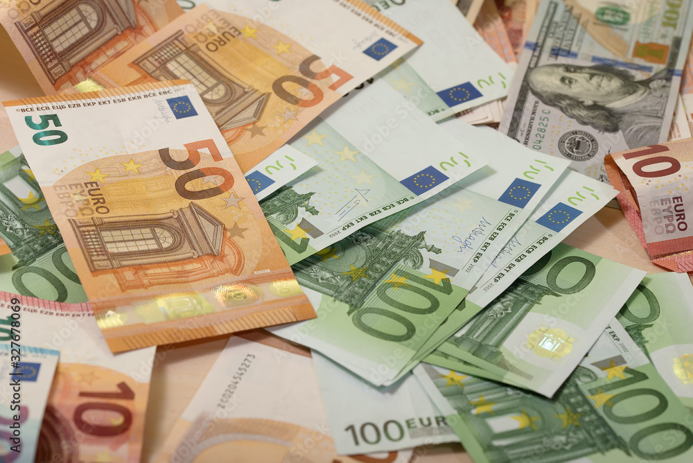 Background of dollar, euro banknotes on a table