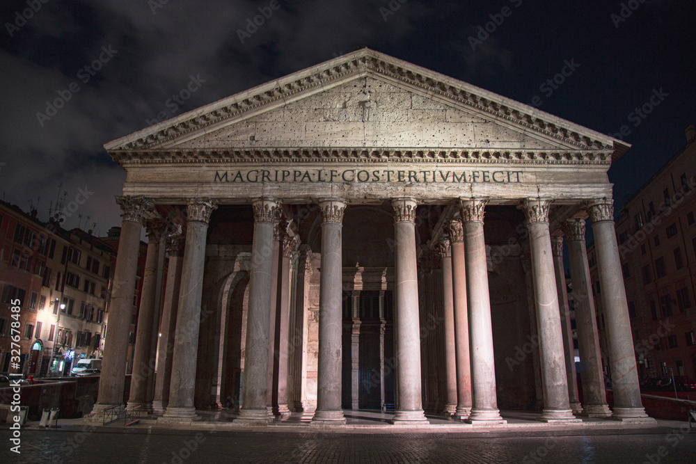 The Pantheon of Rome at night with a cloudy sky, Italy	
