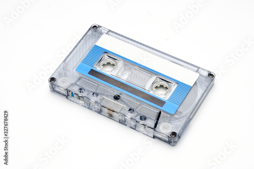 Compact audio tapes for magnetic recording on a white background.Compact cassettte