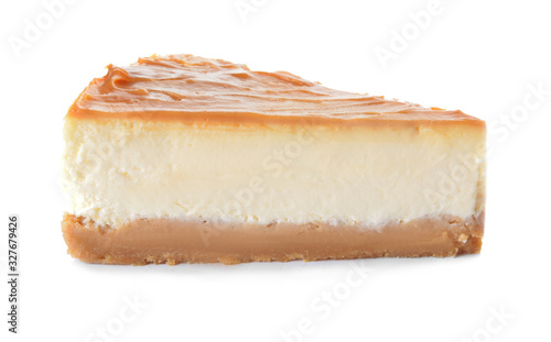 Slice of sweet caramel cheesecake on white background