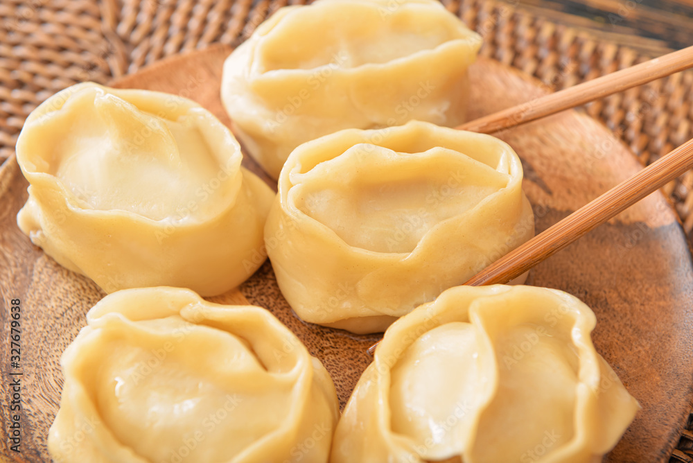Eating of tasty oriental dumplings, closeup Eating of tasty oriental dumplings, closeup