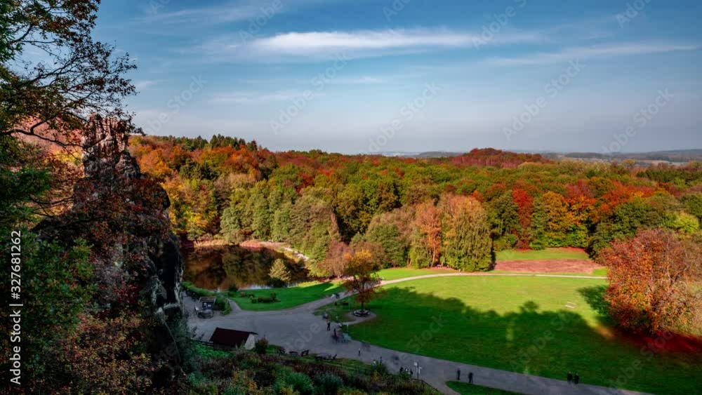 Moutain hills and lakes timelapse with vibrant fall colors fir trees with orange red and yellow leaves in Germany. Autumn mountain lake clouds time lapse Moutain hills and lakes timelapse with vibrant fall colors fir trees with orange red and yellow leaves in Germany. Autumn mountain lake clouds time lapse