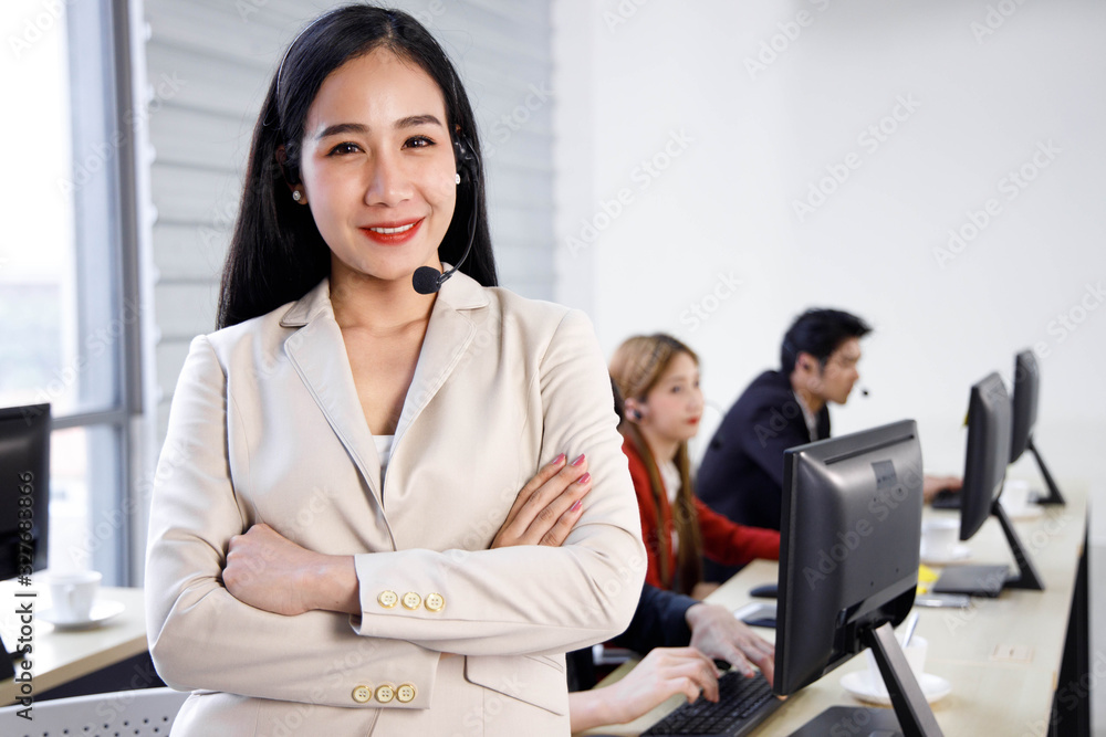 Obraz premium Portrait of happy and confident Asian woman call center operator agent at office. Concept for customer support service, lifestyle at office, employee.