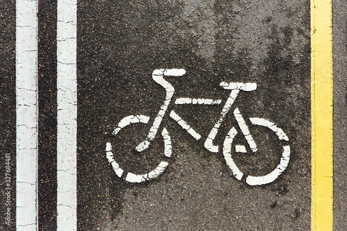 yellow and white asphalt bike path