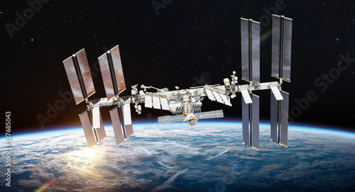 Fototapeta Naklejka Na Ścianę i Meble -  International space station on orbit of Earth planet. ISS. Elements of this image furnished by NASA	