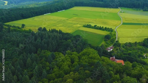 Aerial view of the  village and castle Gamburg in Germany. Wide view with pan to the right from the woods to the castle. photo