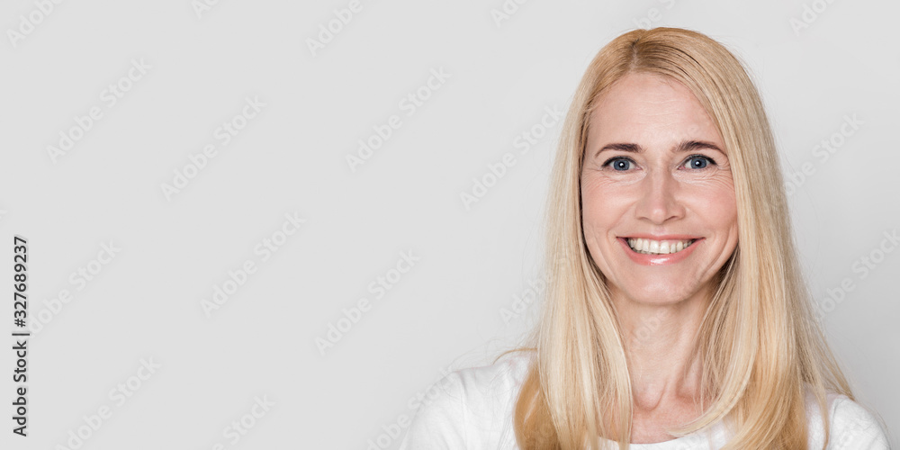 Beautiful middle aged woman smiling at camera Beautiful middle aged woman smiling at camera