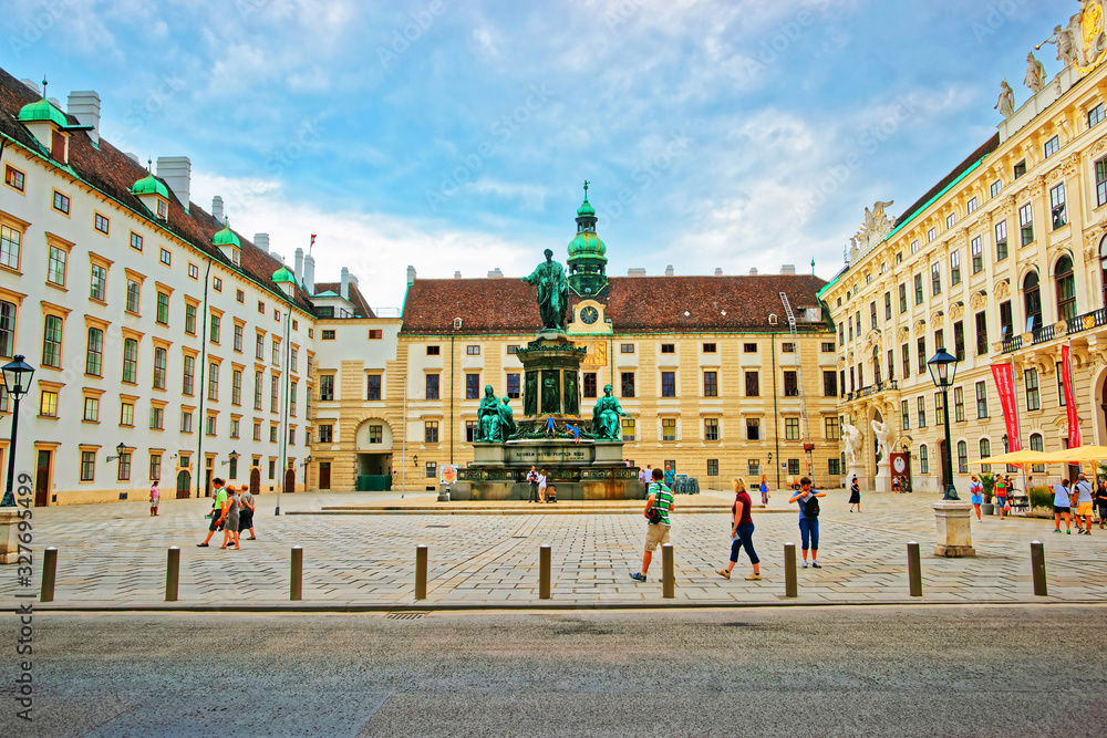 Tourists at Amalienburg and inner courtyard in Vienna