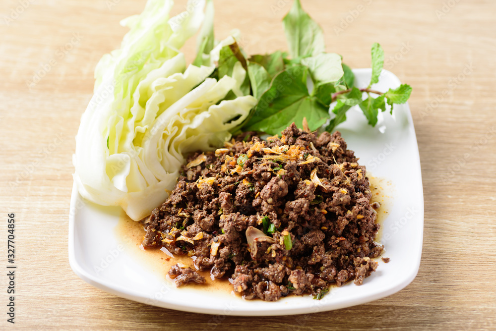 Traditional Northern Thai food, spicy minced pork salad (Larb Moo Kua) Traditional Northern Thai food, spicy minced pork salad (Larb Moo Kua)
