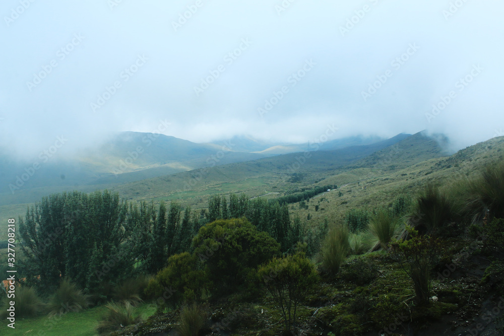 Mist is coming in at the mountain side of the andes, a typical view in winter time