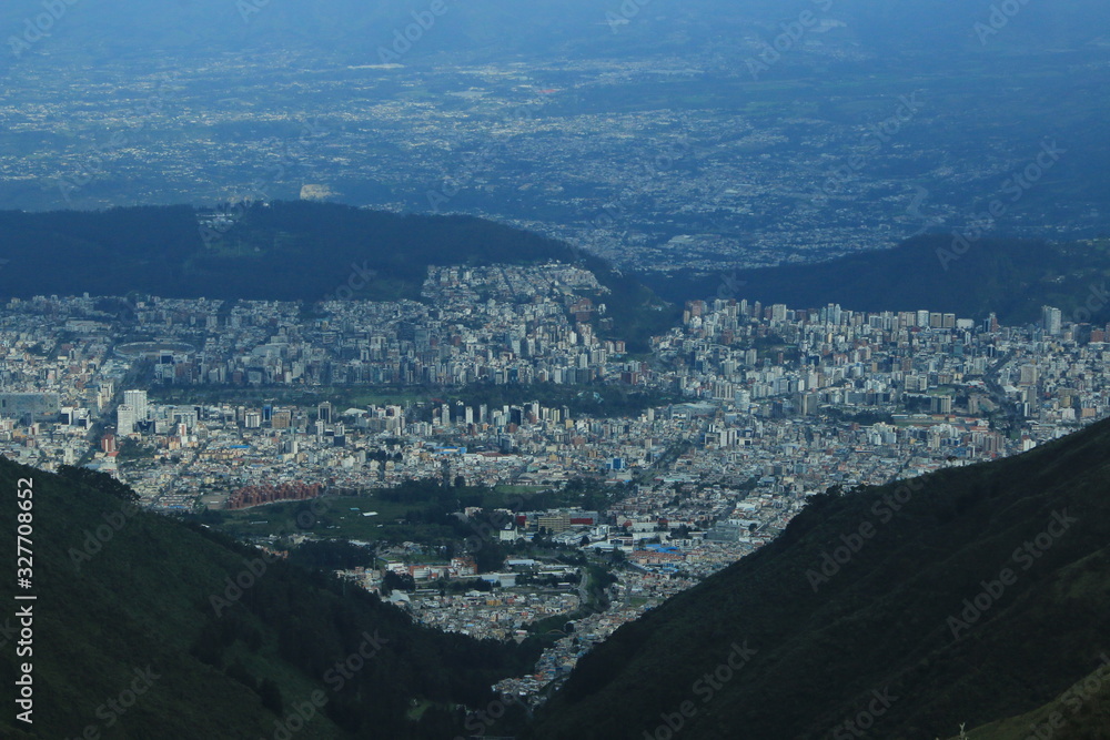 Quito, very large city located in a valley of the andean mountains seen from the top of the mountain Rucu Pinchincha Quito, very large city located in a valley of the andean mountains seen from the top of the mountain Rucu Pinchincha