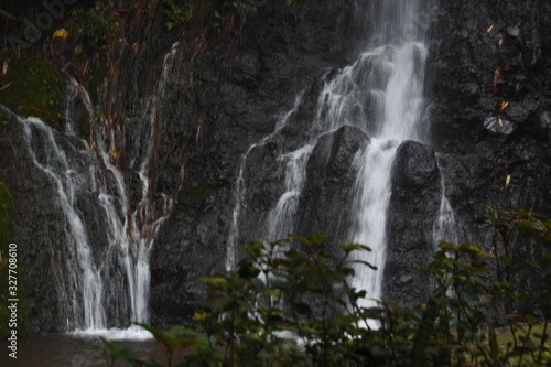 waterfall in the middle of the forest. waterfall flow. Beautiful natural waterfall