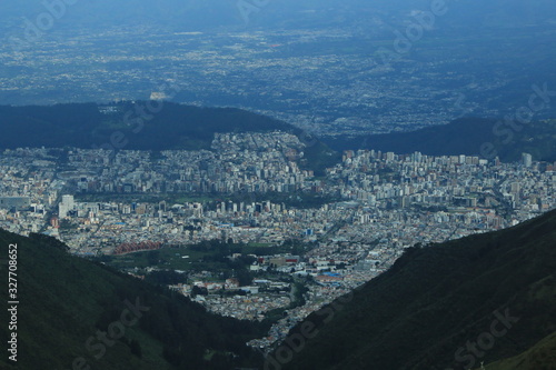 Quito, very large city located in a valley of the andean mountains seen from the top of the mountain Rucu Pinchincha photo