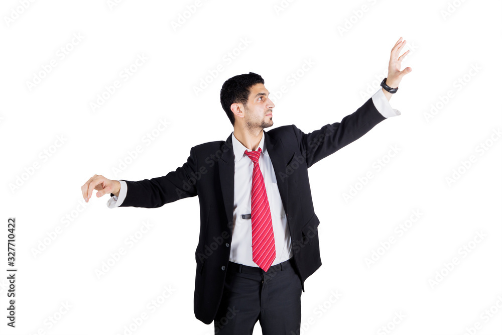 Businessman touching something on virtual screen Businessman touching something on virtual screen