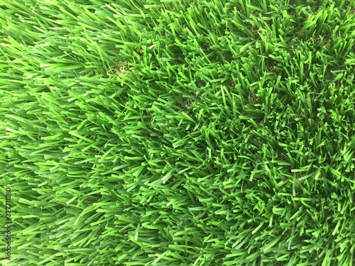 An above view of close up of fake grass showing the many plastic grass stems