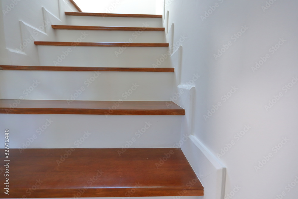 brown wooden stair and white wall in residential house brown wooden stair and white wall in residential house