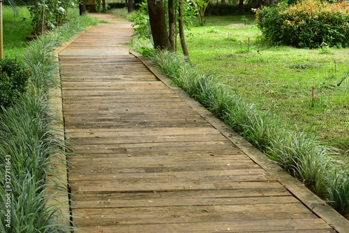 concrete brick pathway in green natural park © sutichak