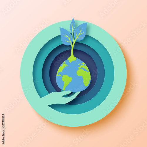 Save the world with human hand holding the earth and growing plant.Earth day concept paper art style vector illustration.