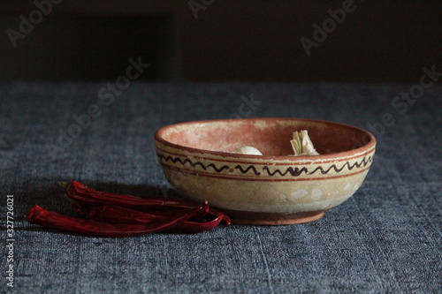 garlic and chillies in old serbian clay bowl
