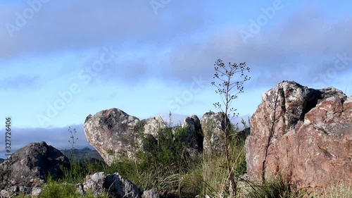 Top Of Mountain With Blue Sky Behind In Sierra de la Ventana, Argentina On A Sunny day -wide shot photo